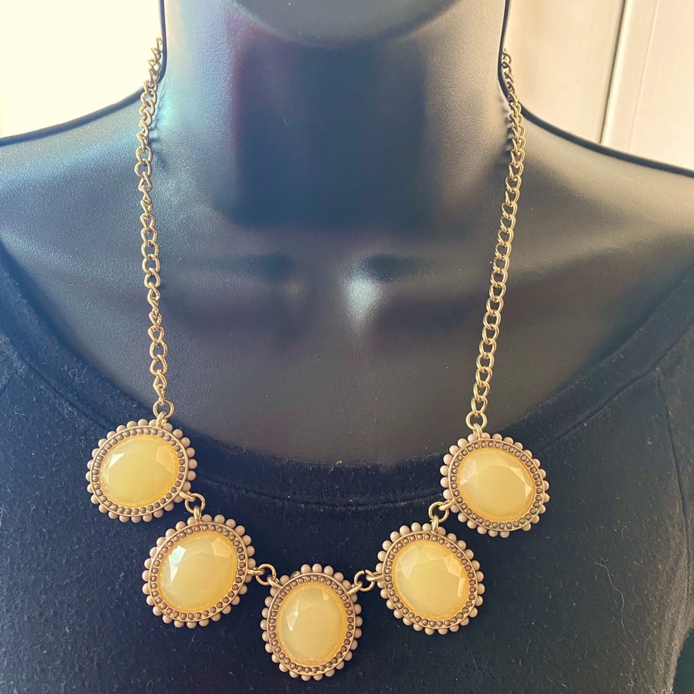 Muted yellow disk gold tone necklace